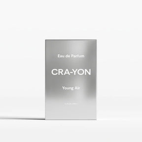 A rectangular silver perfume box standing upright on a white background. The box has a brushed metallic finish with white text reading 'Eau de Parfum', 'CRA-YON', and 'Young Air'.