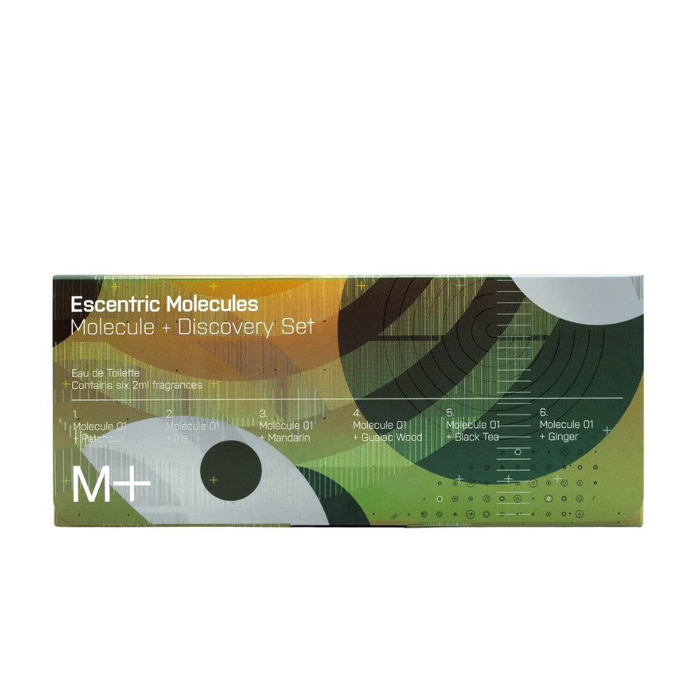 A rectangular product box for 'Escentric Molecules Molecule + Discovery Set' by M+, featuring an abstract design with green, yellow, and white geometric shapes and text details.